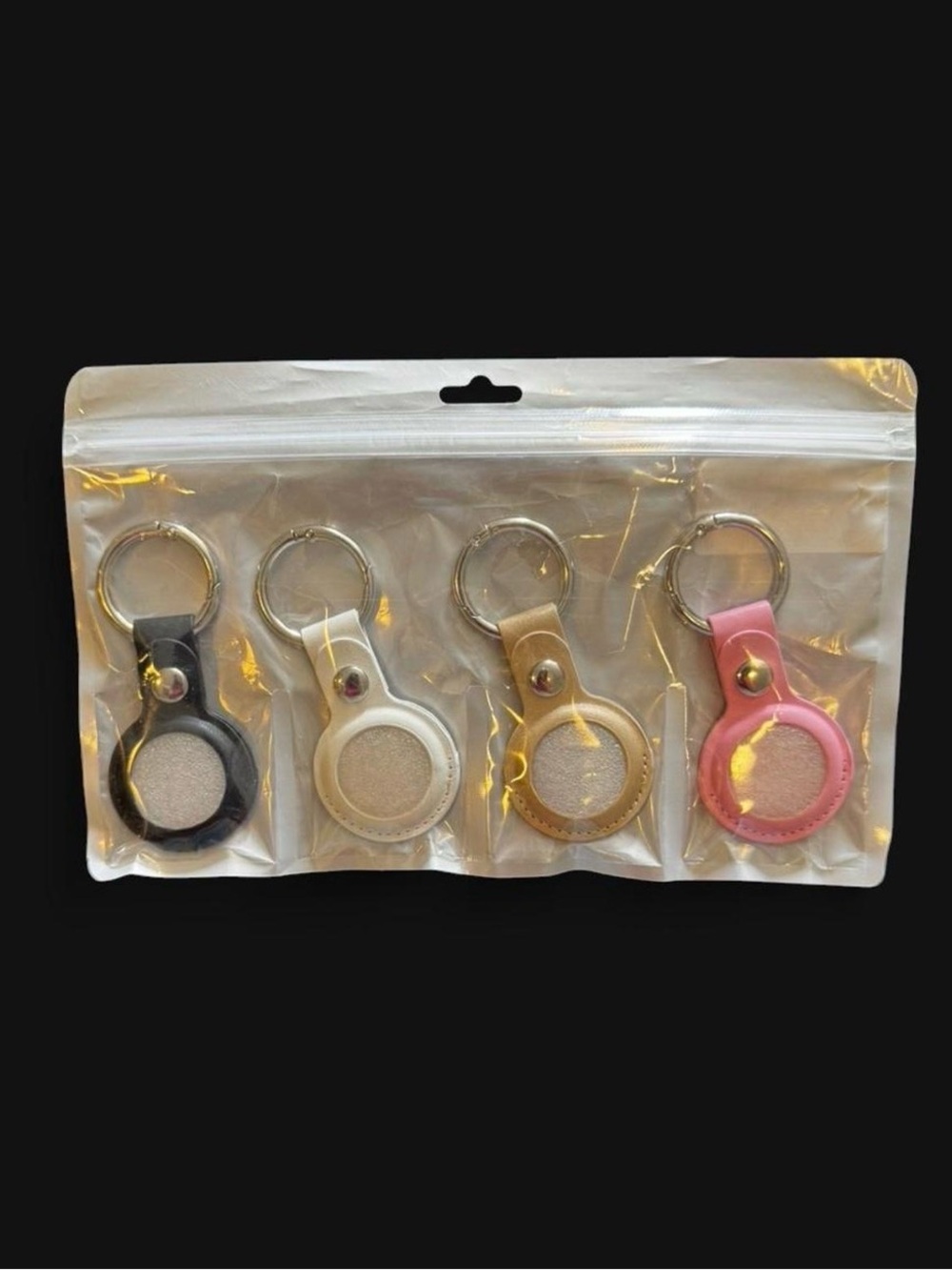 4 Leather AirTag Keyring Set in Black, White, Gold, Pink